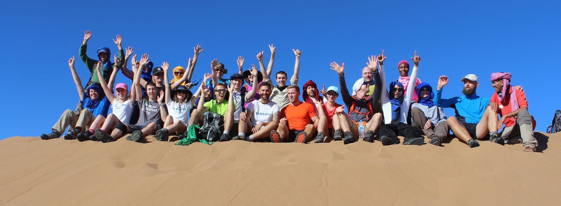 Discover Adventure challenge group celebrating in the Sahara